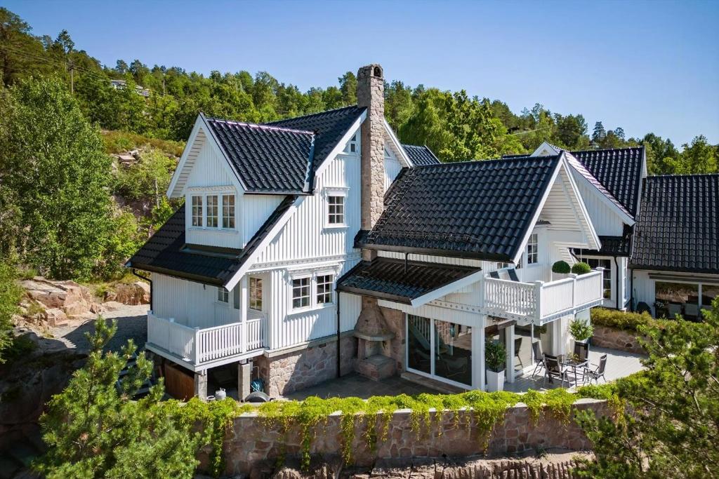 an aerial view of a house with a roof at Beach House With Multiple Terraces In Holmsbu in Holmsbu