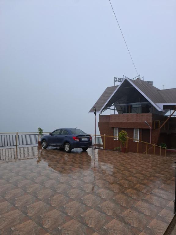 a car parked in front of a house at Merjin's Paraiso in Vagamon