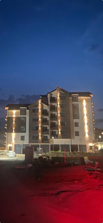 a large building with lights on it at night at Anonim Plus in Vrdnik