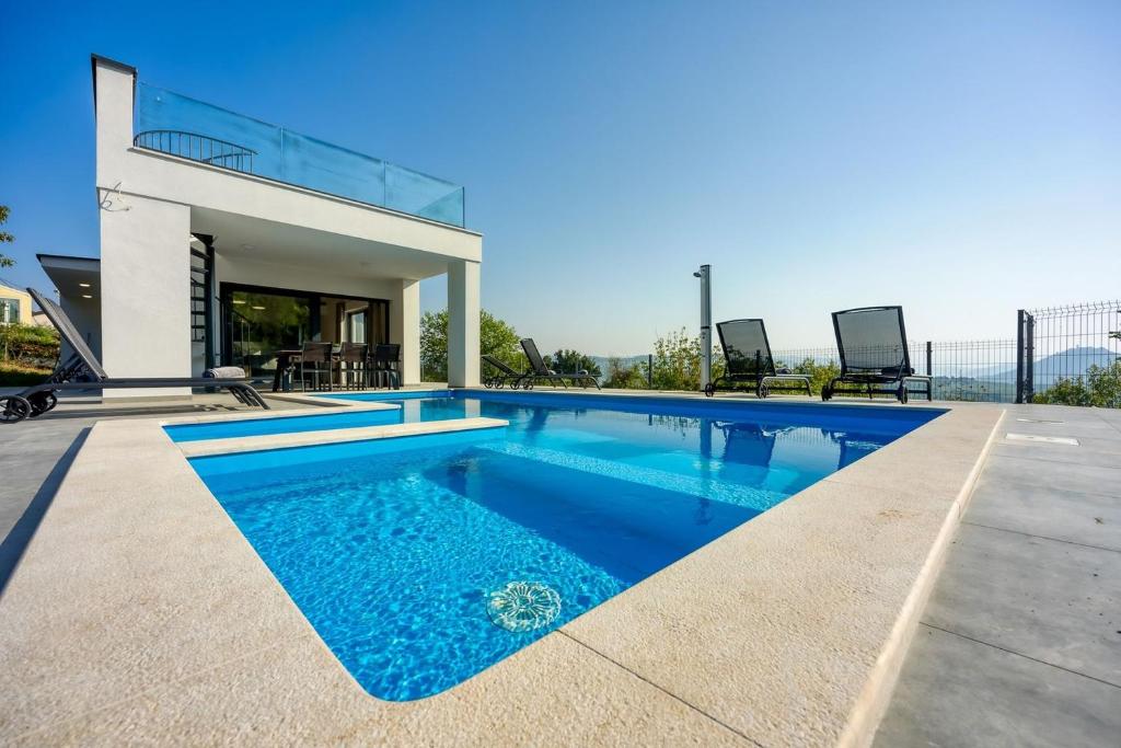 a swimming pool in the backyard of a house at Villa Nono in Motovun
