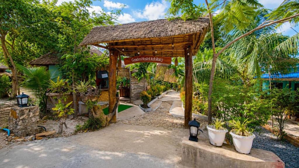 a pavilion with a sign in front of a resort at Garden Hostel Koh Rong in Koh Rong Island