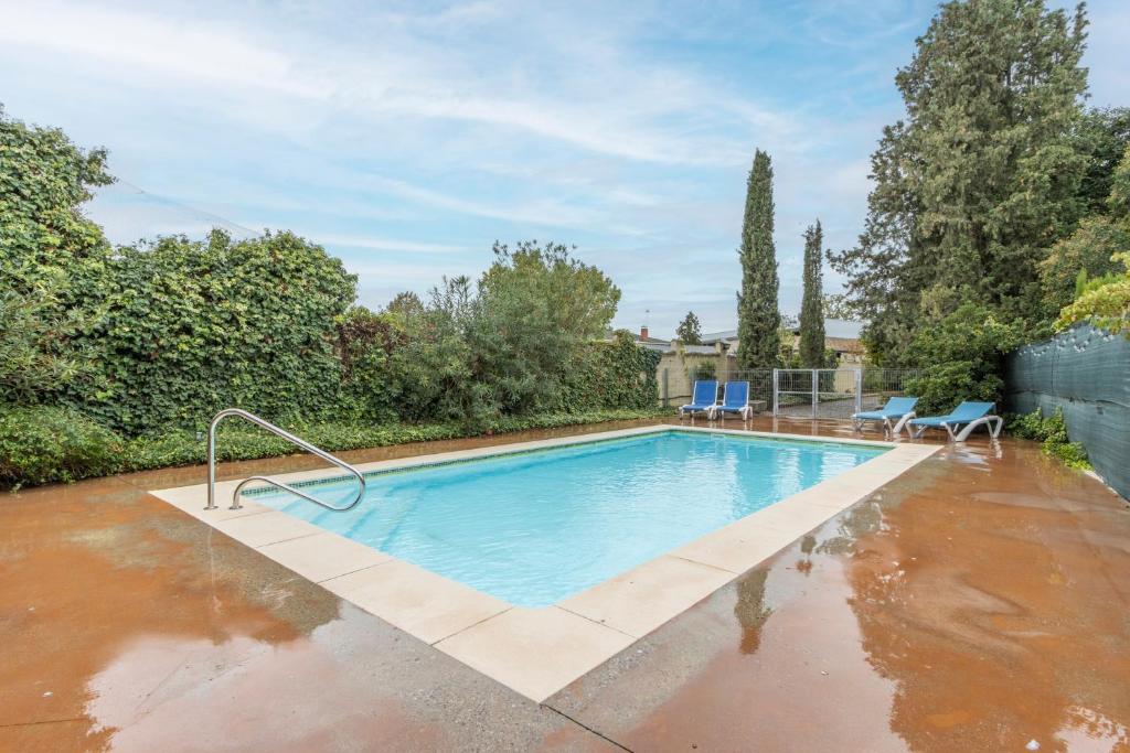 a swimming pool in a house with water on the ground at Petit Ca l'Andorrà in Vila-Sana