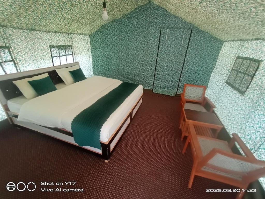 a rendering of a bedroom with a bed and a chair at Kayok camp hunder in Nubra