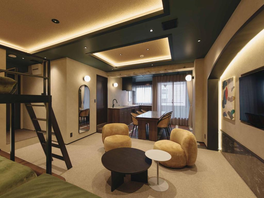 a living room with a loft bed and a table at illi Harb Shibuya-Ebisu in Tokyo