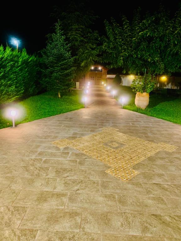 a pathway with a star on the ground at night at Forest view evia in Prokópion