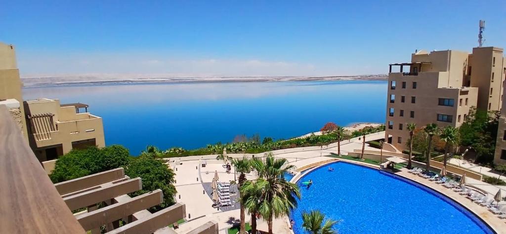 a view of the water from a building with a pool at Bella by the Sea in Sowayma