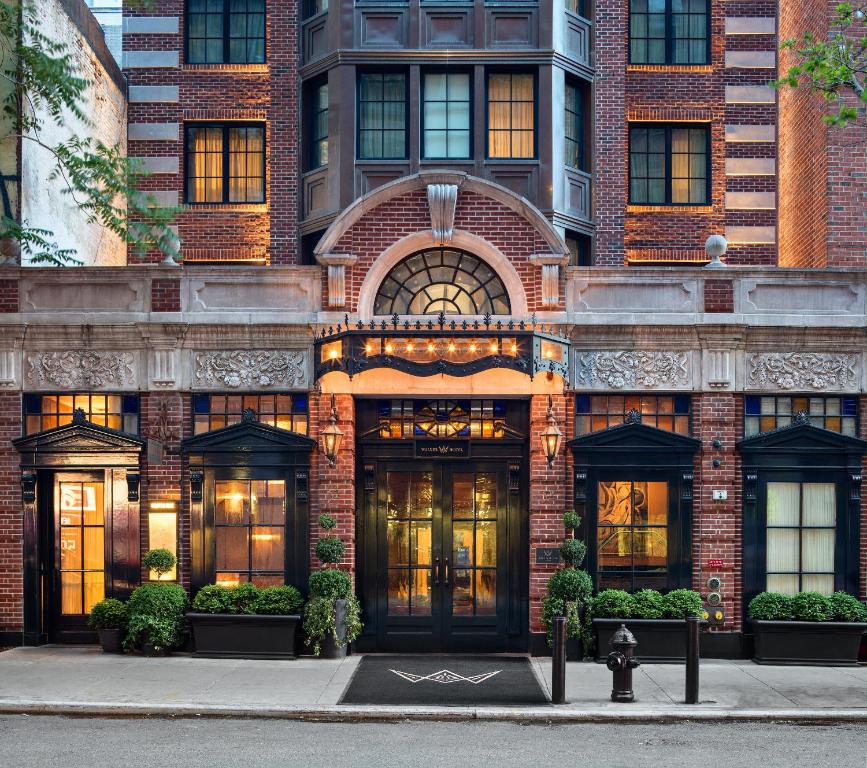a building with a fire hydrant in front of it at Walker Hotel Greenwich Village in New York