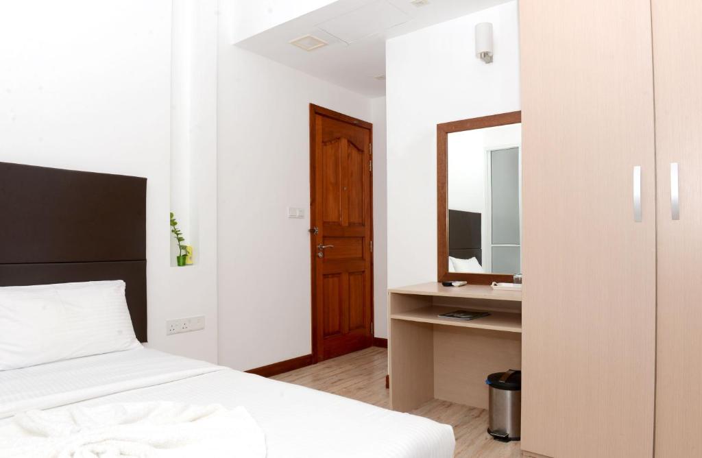 Postel nebo postele na pokoji v ubytování Express Inn at Hulhumale