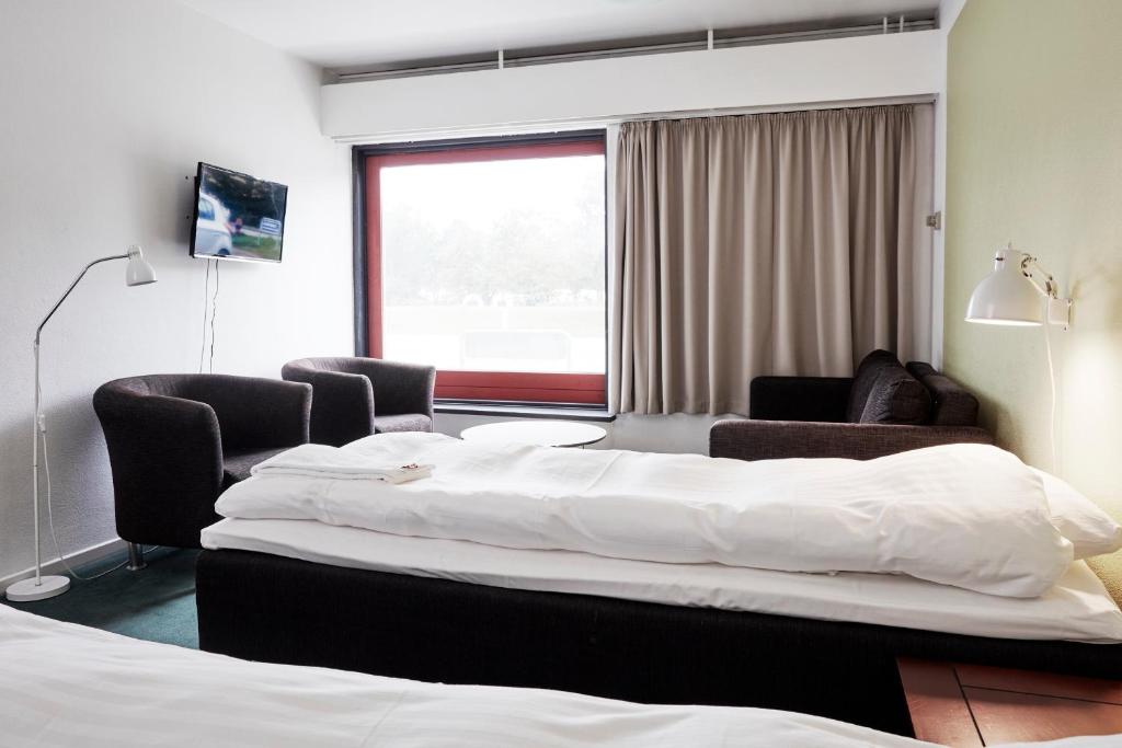 Ένα ή περισσότερα κρεβάτια σε δωμάτιο στο Ebeltoft Park B & B