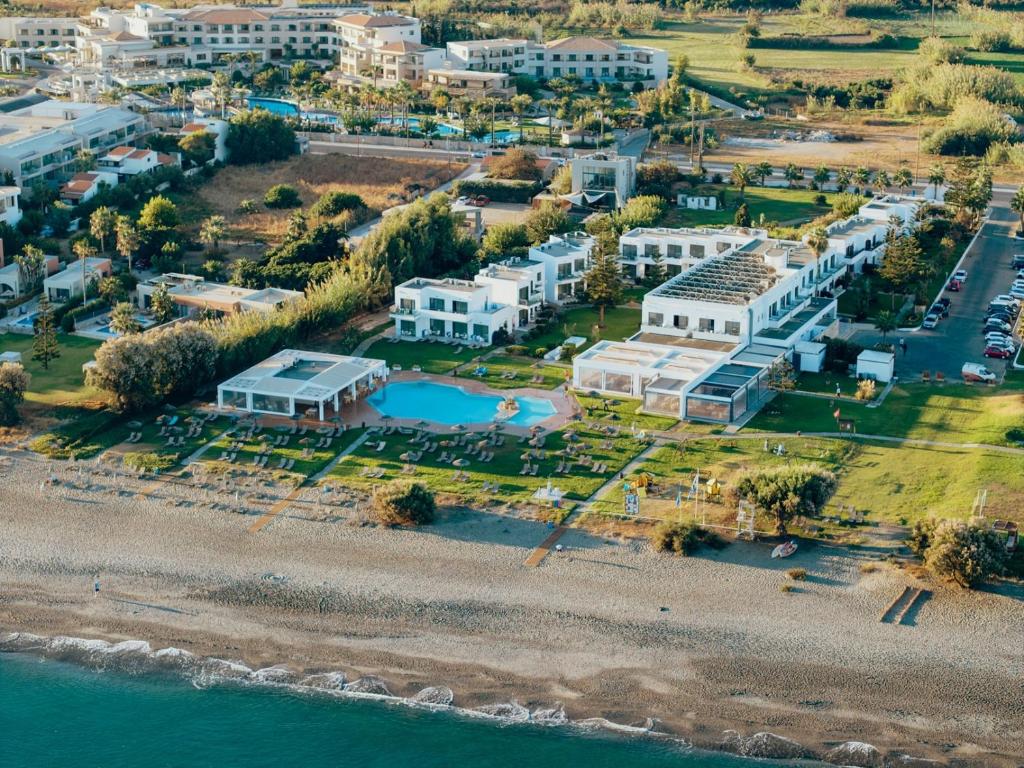 an aerial view of a resort next to the water at Geraniotis Hotel and Resort in Platanias