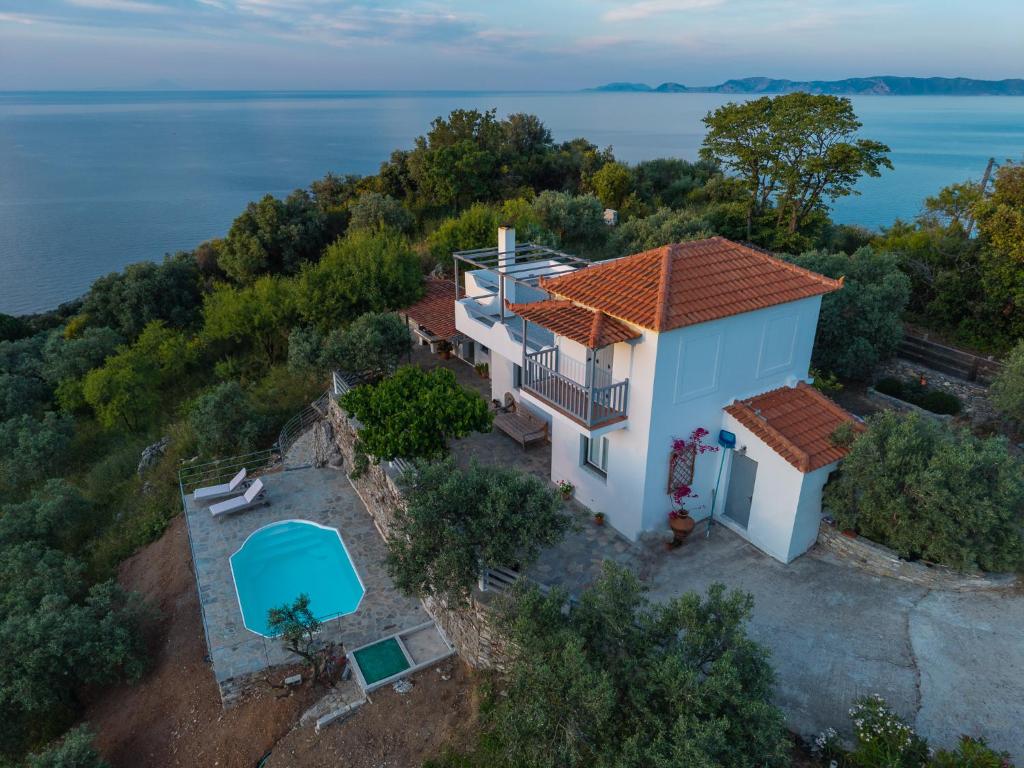 an aerial view of a house with a swimming pool at Villa Rose in Glossa