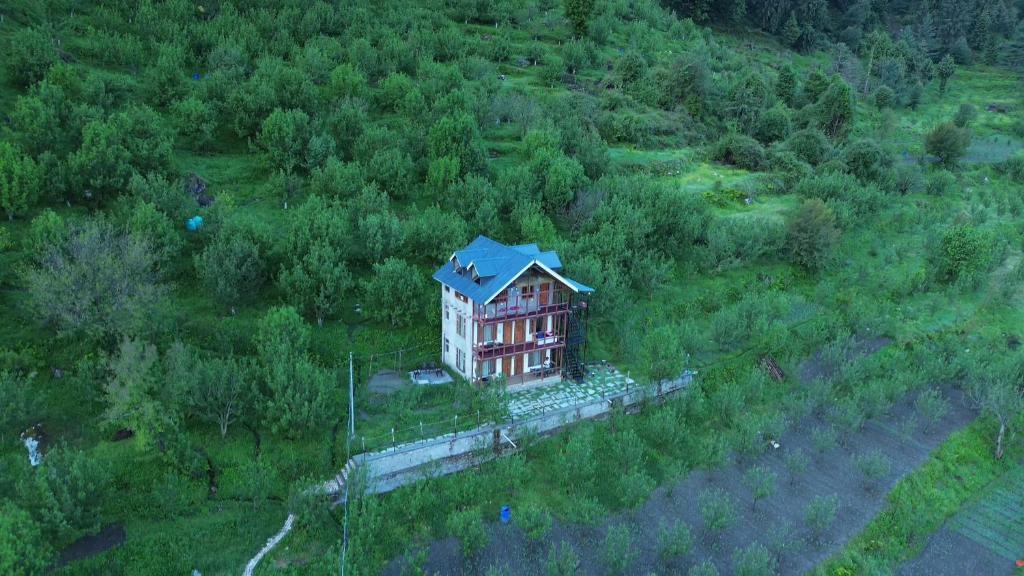 an aerial view of a house in a field at Sukun Hostel in Sainj