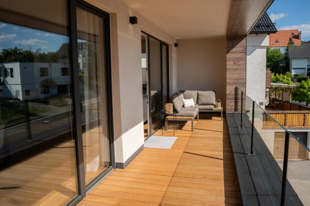 a balcony with a view of a living room at LOFT 21 Rhön in Hofbieber