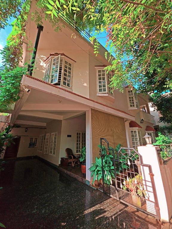 a house with a courtyard in front of it at Manasthala Brindavan in Mysore