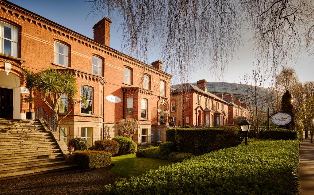 a large brick building with a clock on the side of it at Ariel House in Dublin