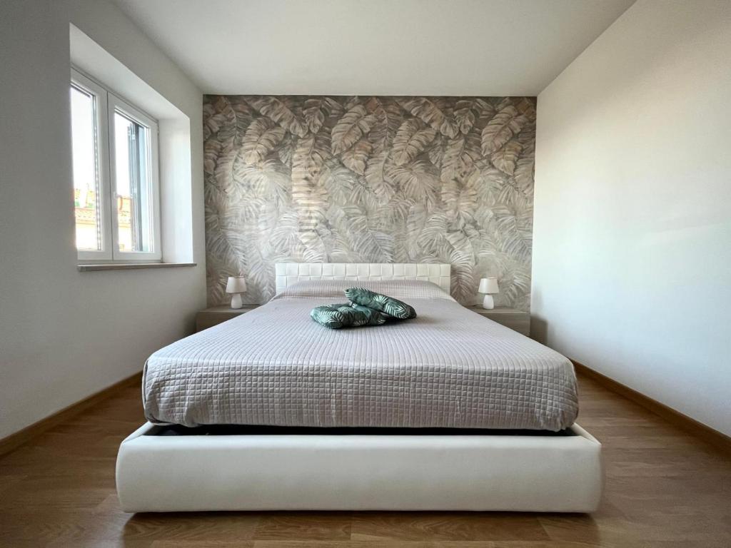 a bedroom with a bed with a pillow on it at Casa Araiani in Ariano Irpino