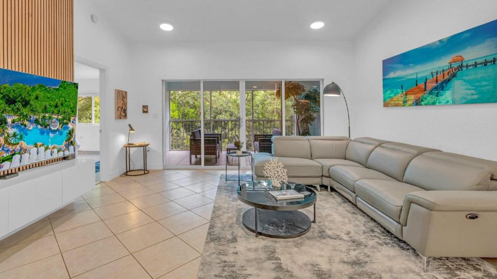 a living room with a couch and a table at 812 Mariners Club in Key Largo