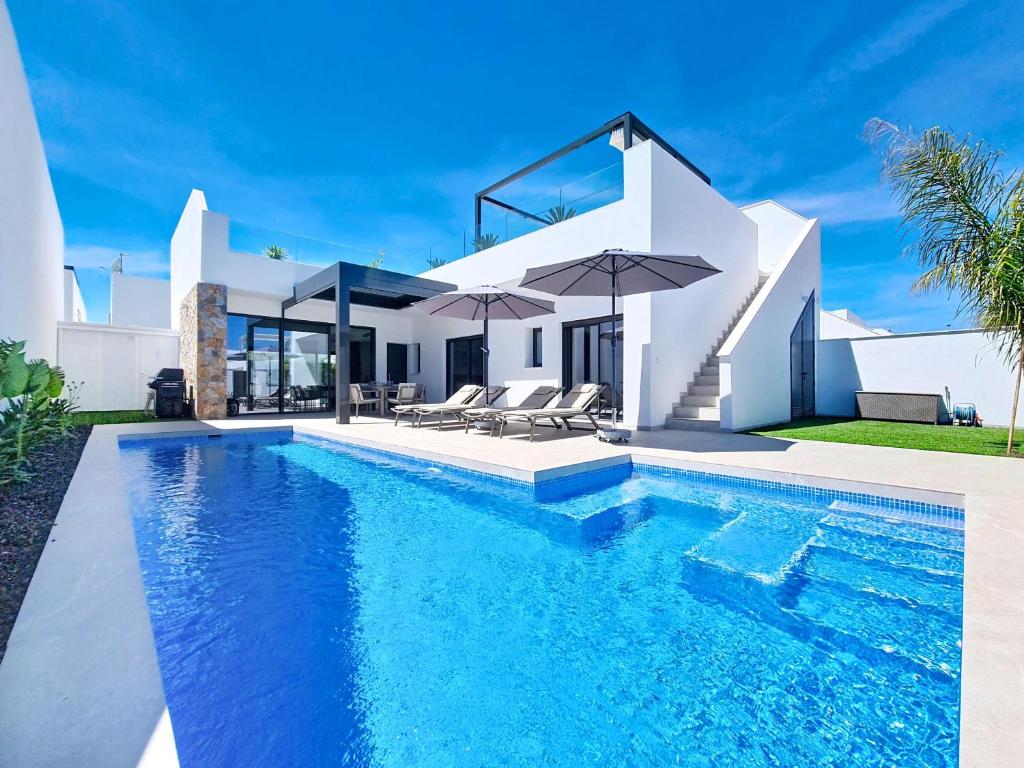 a villa with a swimming pool and a house at Casa Colisa - 8610 in San Javier