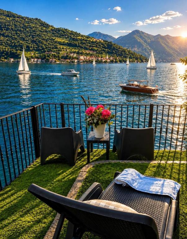 a patio with a view of the water and boats at Diamante sull'acqua in Sale Marasino