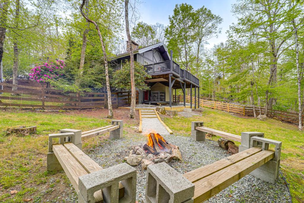 a fire pit in front of a house at 'Bear Crossing Chalet:' Beech Mountain Family Home in Beech Mountain