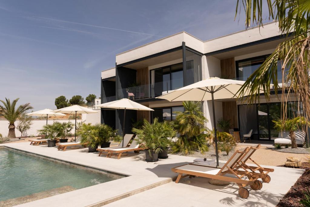 an exterior view of a villa with a swimming pool at Luxury Experience Suites in Toledo