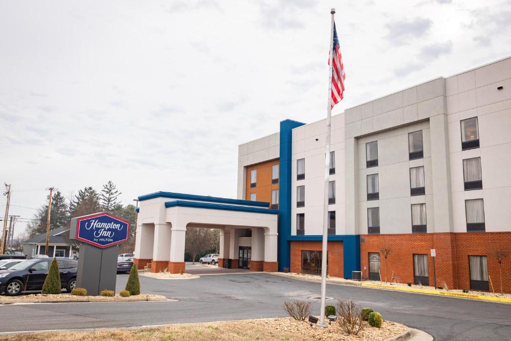 an office building with an american flag in front of it at Hampton Inn Inwood in Inwood