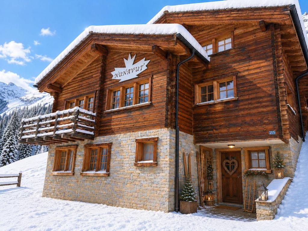 a log cabin in the snow with a sign on it at Chalet Nunavut, Ski in - Ski out with Complimentary Spa Access in Zermatt