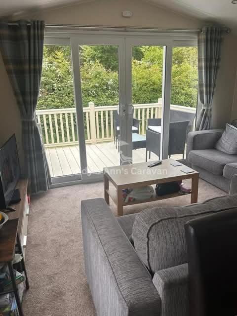 a living room with a couch and a coffee table at 273 Northfield in Skipsea