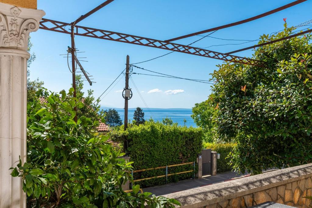 a view of the ocean from a house at Apartman Miriam in Opatija