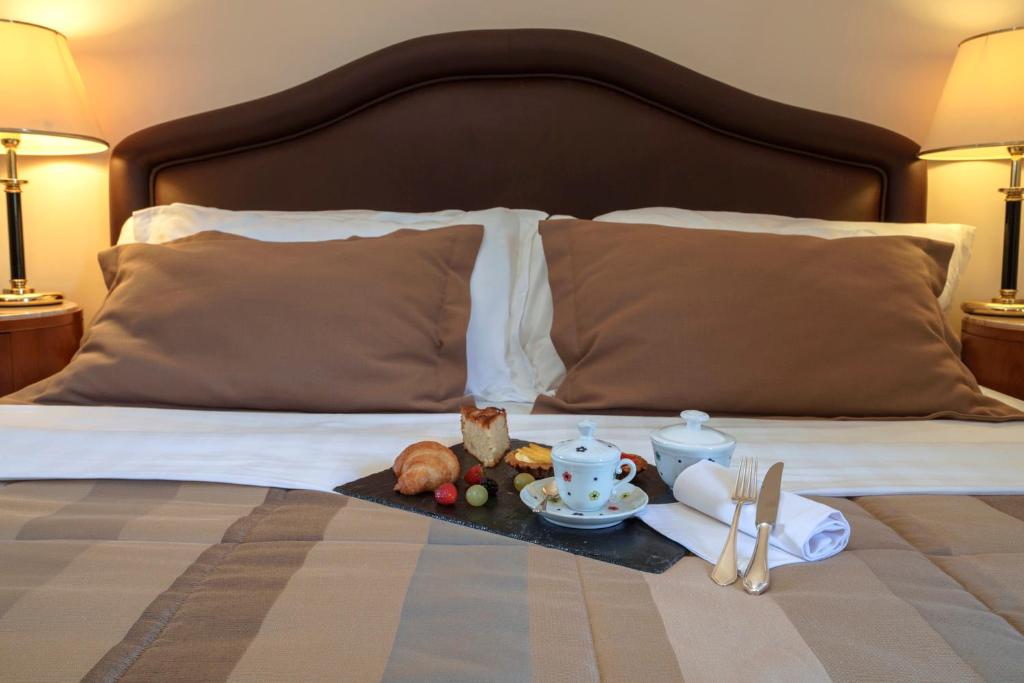 Posteľ alebo postele v izbe v ubytovaní Hotel Cala Del Porto