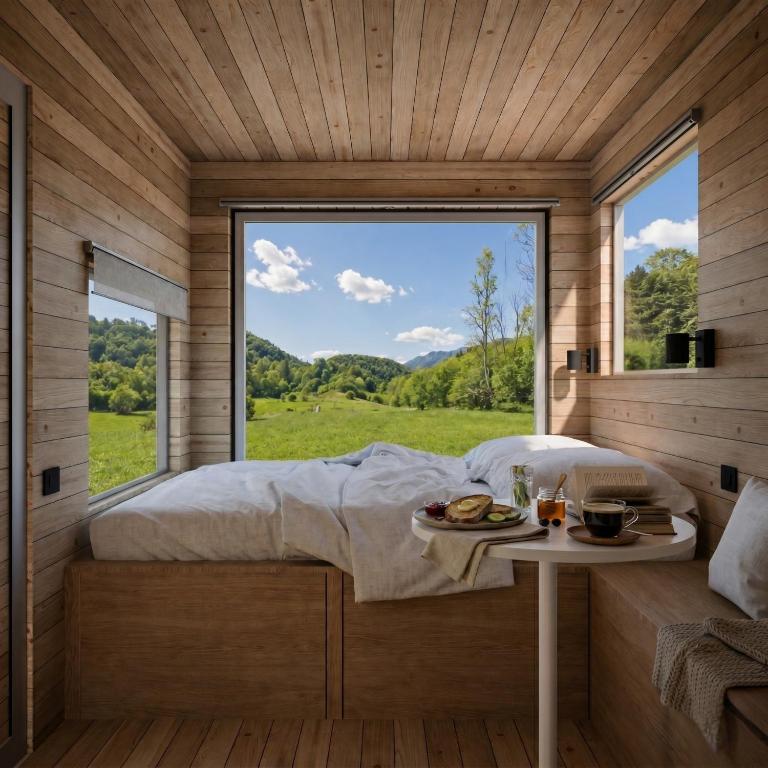 a bed in a room with a large window at BONIS - Nidi nel Bosco in Montemaggiore