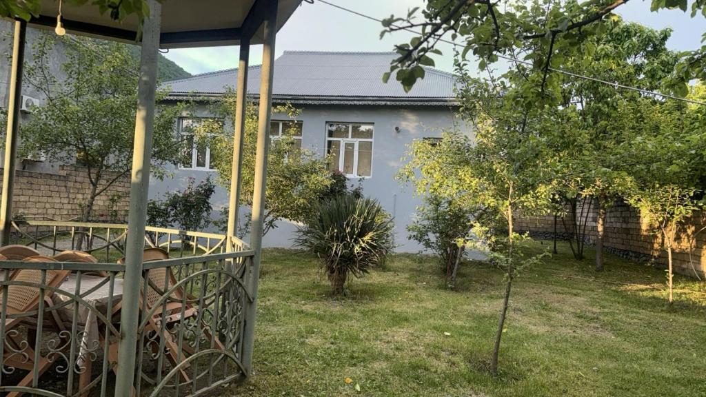 a house with a garden in front of it at Gabala mountain house in Gabala