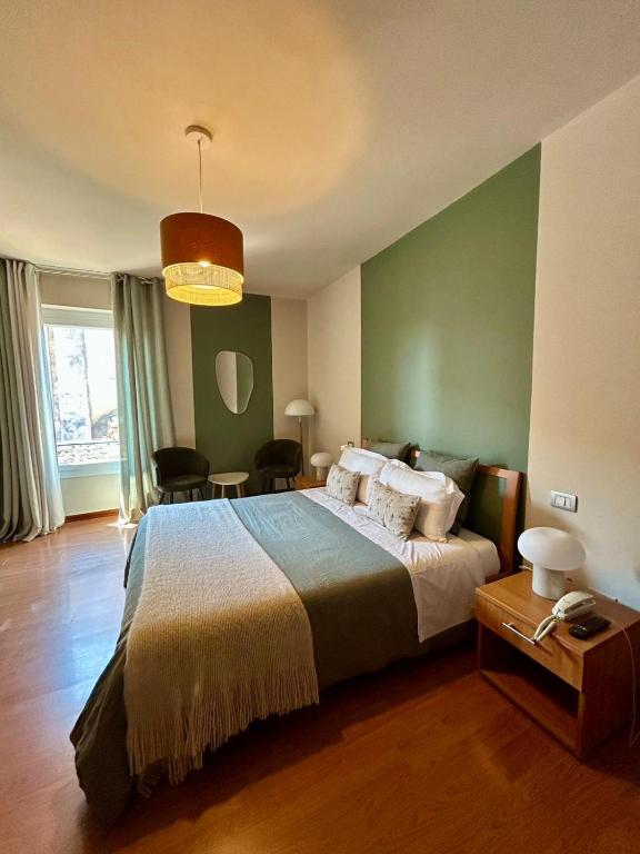 Llit o llits en una habitació de Hotel Moniga