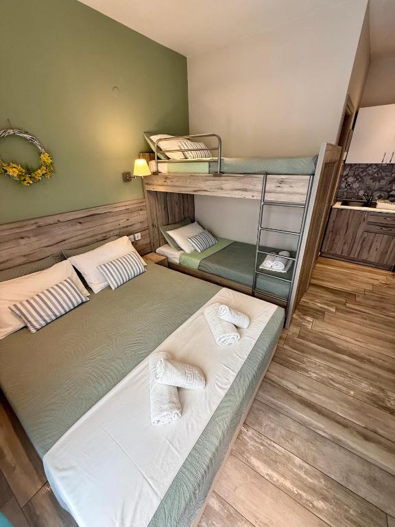two bunk beds sitting in a room with at ΑVLI Sarti Studios & Apartments no 3 in Sarti