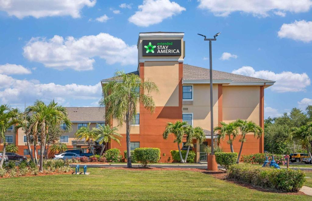 a hotel with a sign in front of a building at Extended Stay America Suites - St Petersburg - Clearwater - Executive Dr in Clearwater