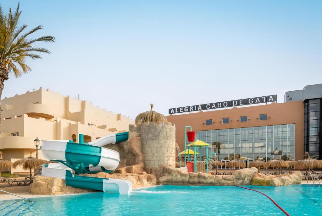 a water slide in a pool at a resort at ALEGRIA Cabo De Gata Aquafun in Retamar