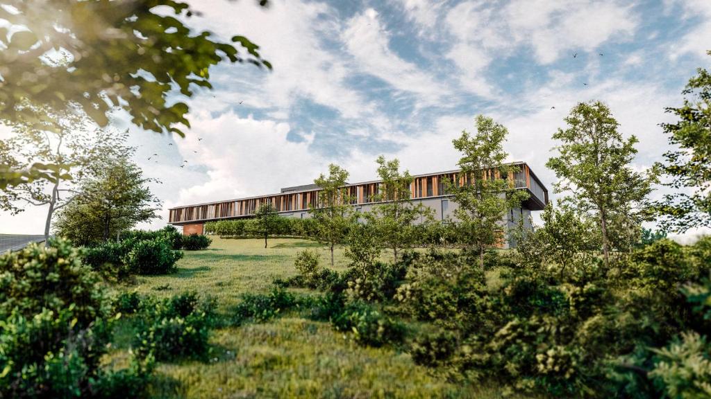 a rendering of a building in a field at Hotel a vinařství Lacina in Velké Pavlovice