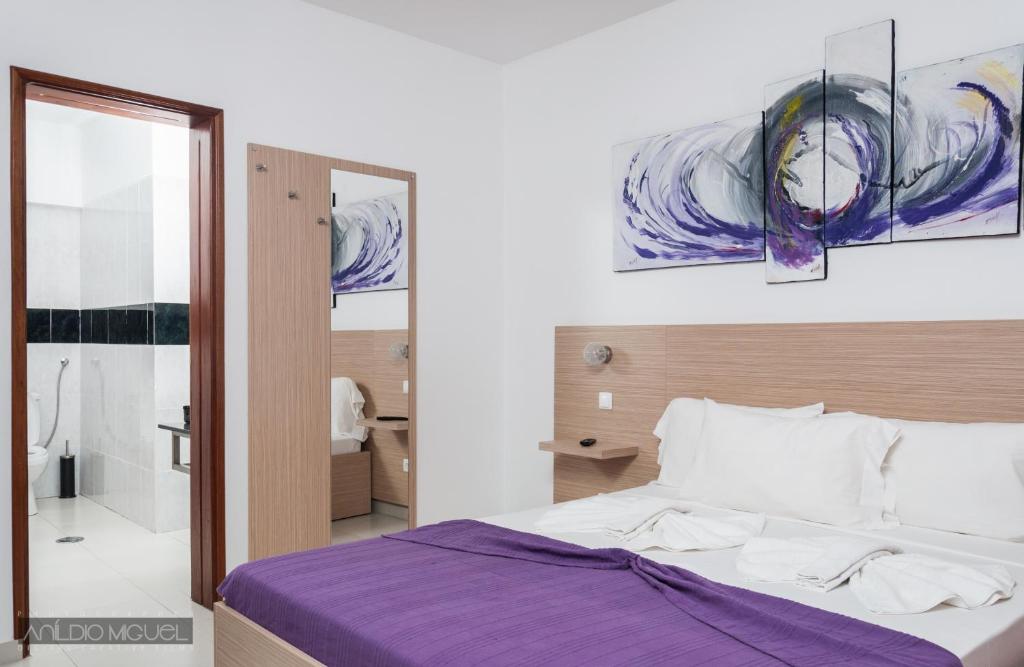 Postel nebo postele na pokoji v ubytování Hotel Cesaria