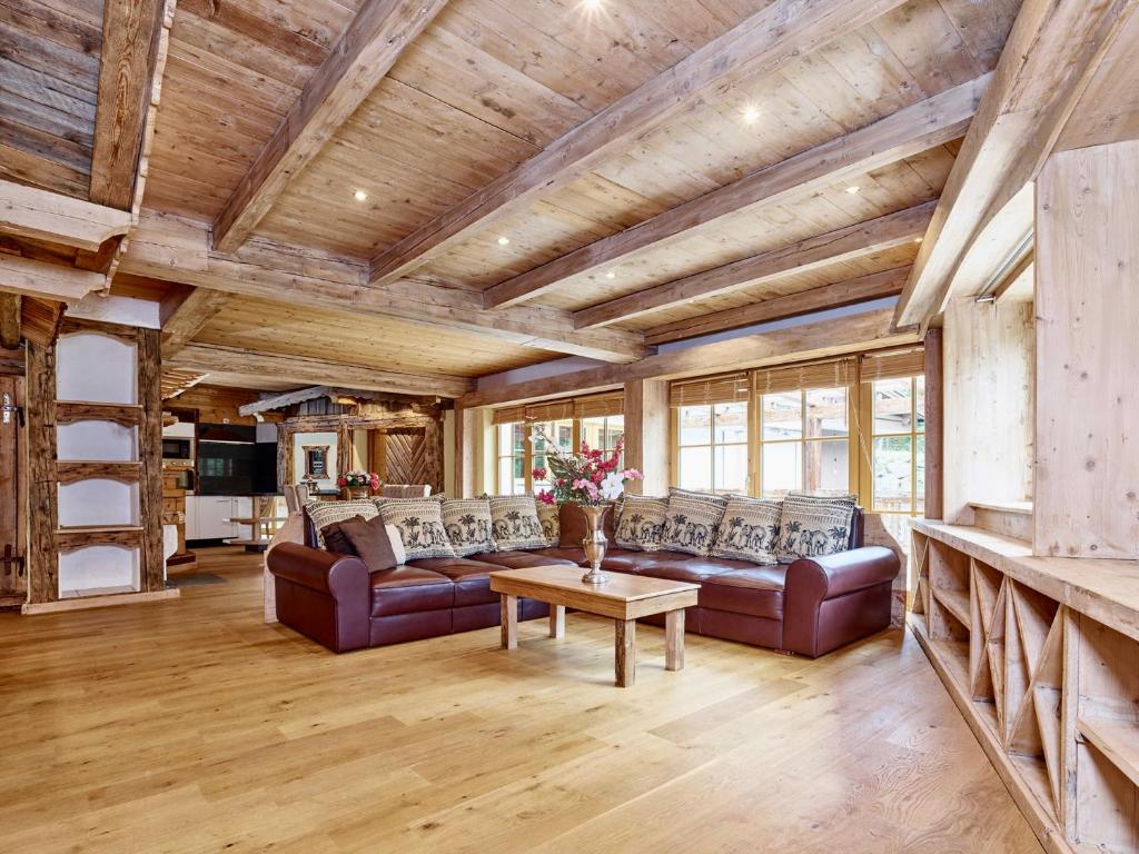 a living room with couches and a table at Emmat Apartments in Leutasch