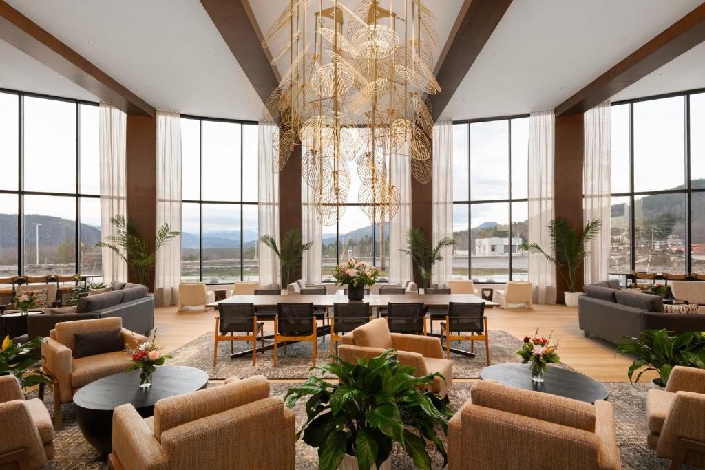 a large room with tables and chairs and a chandelier at Hotel Indigo North Conway by IHG in North Conway
