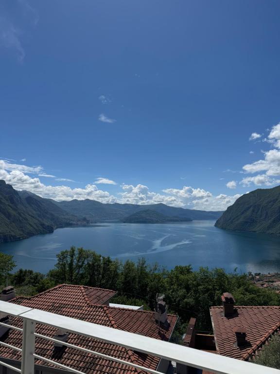 a view of a lake from a balcony at Iseo Collection in Riva di Solto