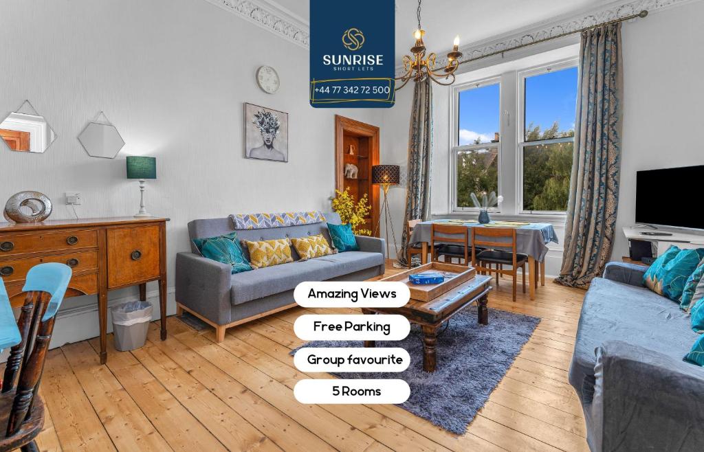 a living room with a couch and a table at DUPLEX - 5 Bed Rooms, Amazing Views, Fully Equipped, Free Parking, WiFi, FAVOURITE for Groups & Businesses, Food, Bars, Shops, Library, River Views, by SUNRISE LONG LETS and SERVICED ACCOMMODATION DUNDEE in Dundee
