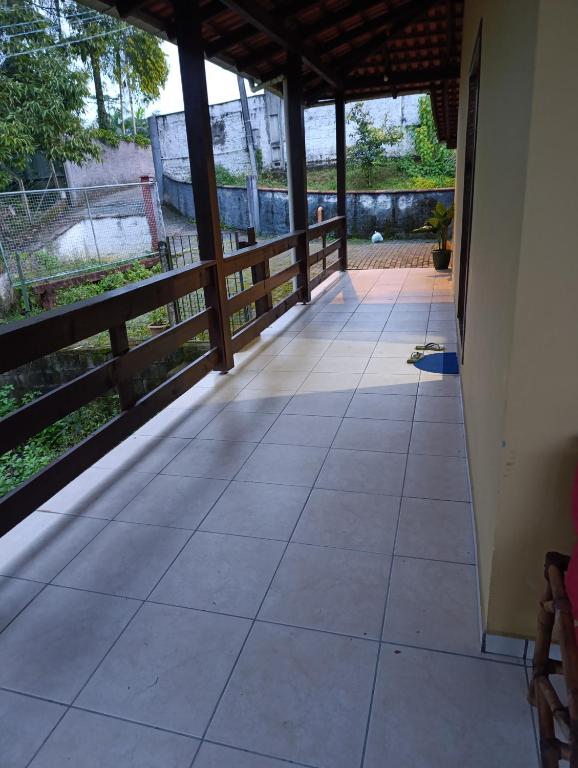 a view from the outside of a house with a tile floor at Casa indaial in Indaial