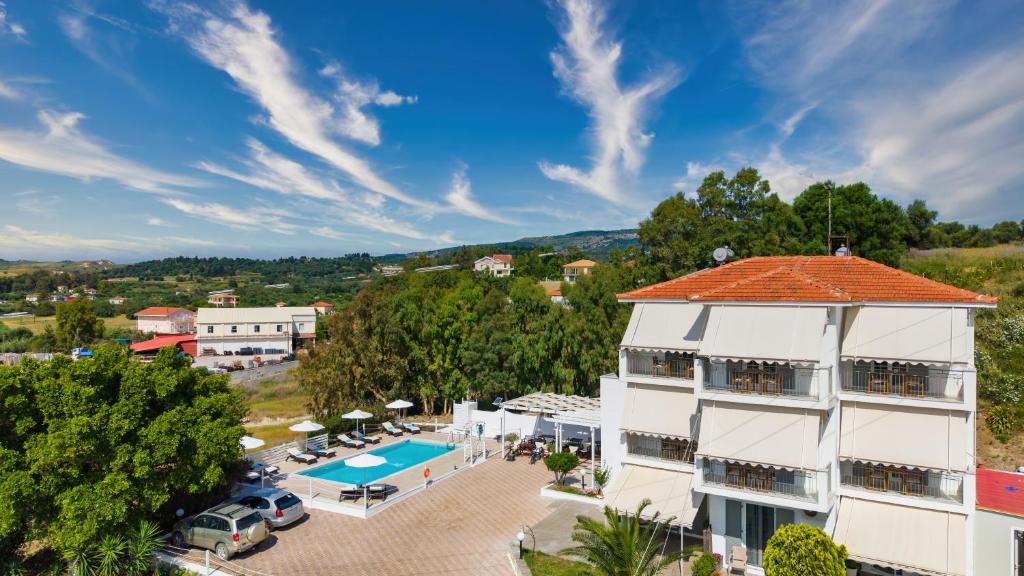 an aerial view of a building with a swimming pool at Aspasia Studios in Lixouri