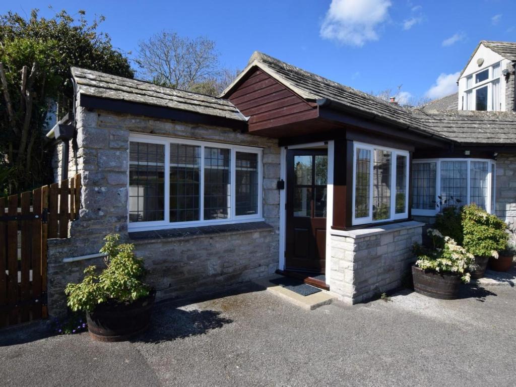 a brick house with a front door and windows at 1 Bed in Swanage oc-dc098 in Swanage