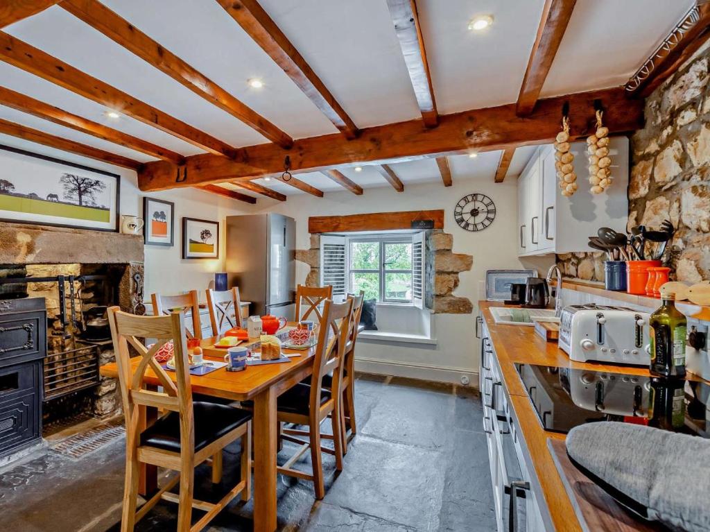 a kitchen with a table and chairs in a room at 2 Bed in Lancaster oc-91411 in Clapham