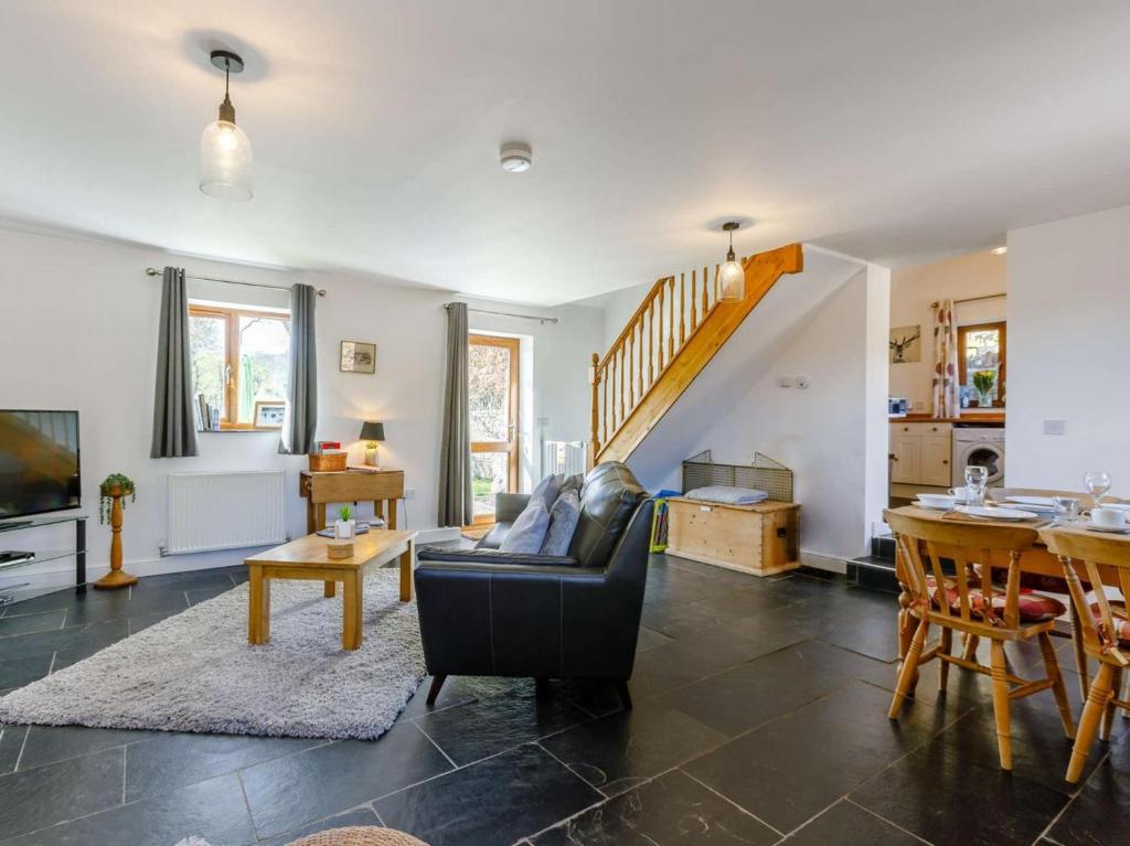 a living room with a couch and a table at 1 Bed in Lydney oc-43724 in Lydney