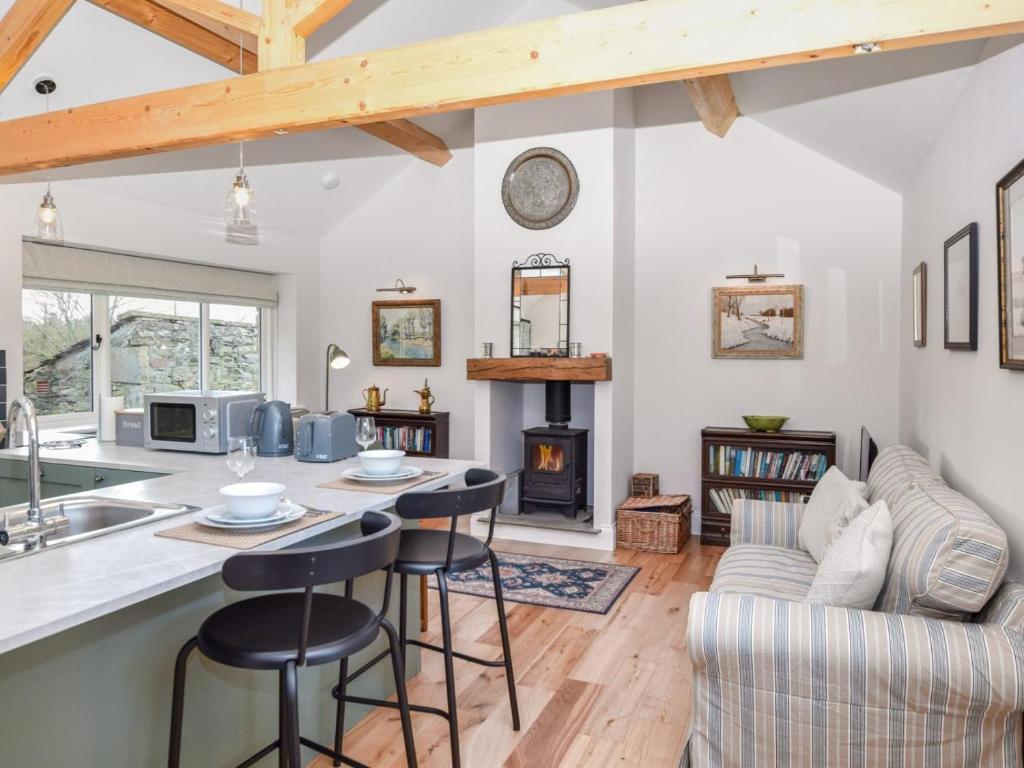 a kitchen and living room with a table and chairs at 1 Bed in Carnforth oc-90554 in Middleton