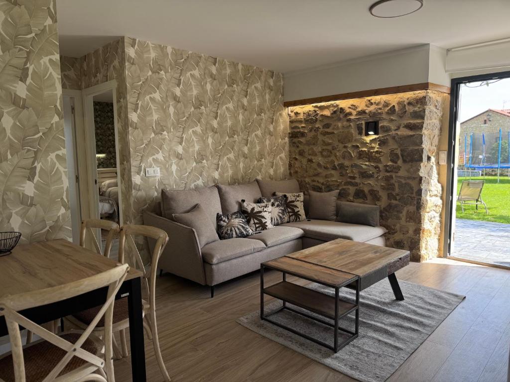 a living room with a couch and a table at Casona de Queveda in Queveda