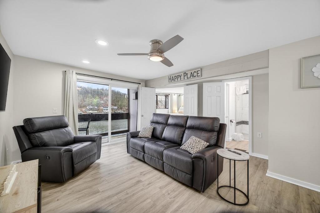 a living room with a couch and a chair at Indoor/Outdoor Pools!! Hot Tub! Steam Room! Sauna! in Osage Beach